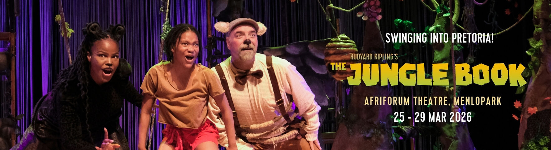 The Jungle Book live stage performance - actors performing on stage with vibrant costumes with the announcement that this is a giveaway