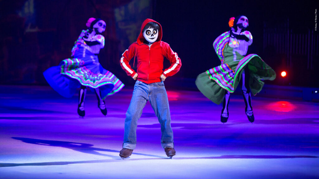 Disney On Ice Mickey’s Search Party Coco-themed performance featuring Miguel and dancers on ice in colourful costumes during a live skating show.