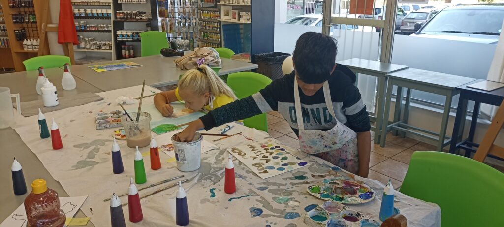 Children painting during a creative kids art class in Durbanville at Art with Kay.