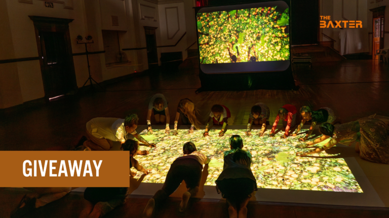 Children and adults interact with a colourful projected forest scene during The Forest at the Baxter Theatre in Cape Town, promoting a family ticket giveaway.