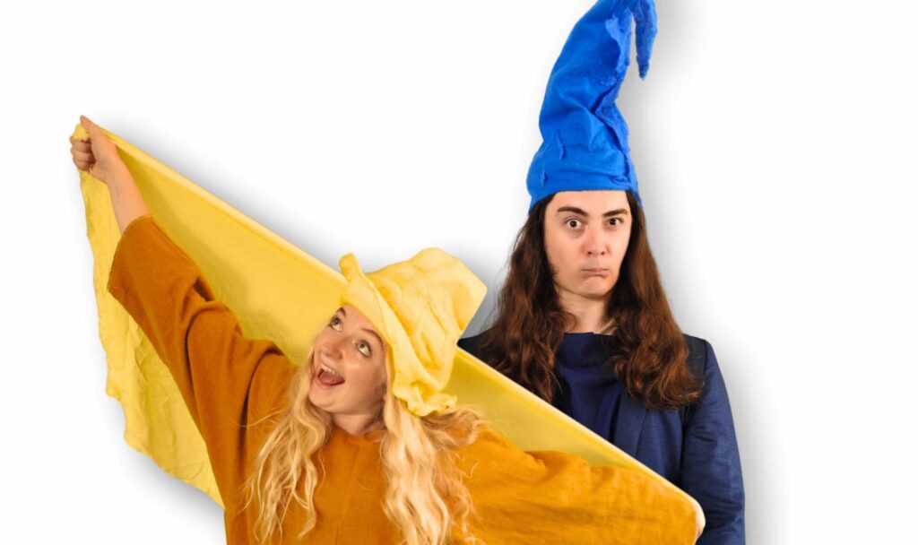 Bluegrommel and Yellowgrommel from the award-winning children’s theatre show Grommels, posing in colourful costumes for the Baxter Theatre Cape Town production.