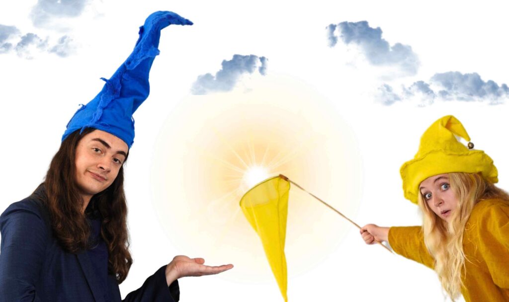 Bluegrommel and Yellowgrommel from Grommels children’s theatre, playing with a yellow net beneath a bright sun for the Baxter Theatre Cape Town production.