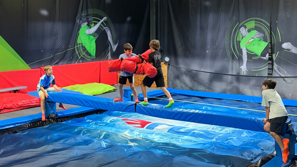 Children enjoying an indoor neon Cosmic Rush event at Rush Claremont in Cape Town